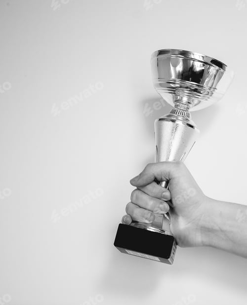 Preview: man holding winner cup on white background