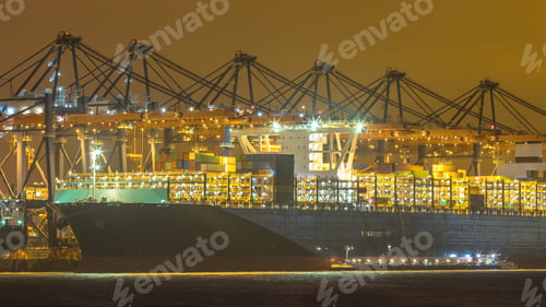 Preview: Cargo carrier ship being loaded and refueled at night