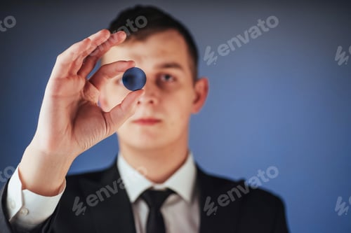 Preview: Young businessman showing empty hands, ready to fill with your design