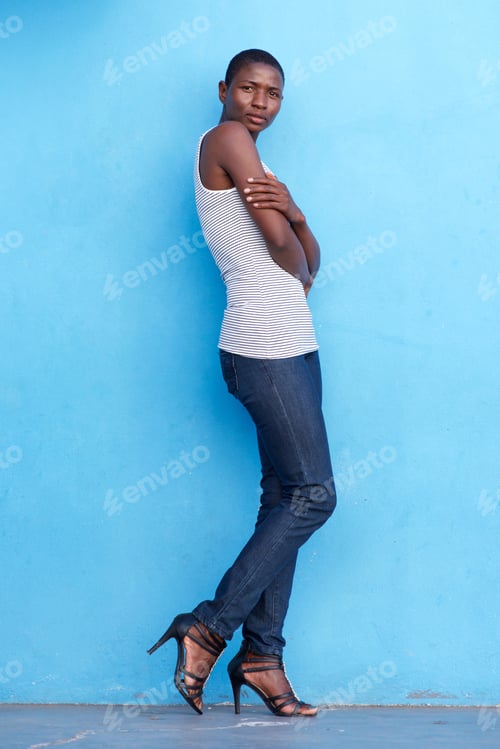 Preview: tall african fashion model standing with tank top and jeans