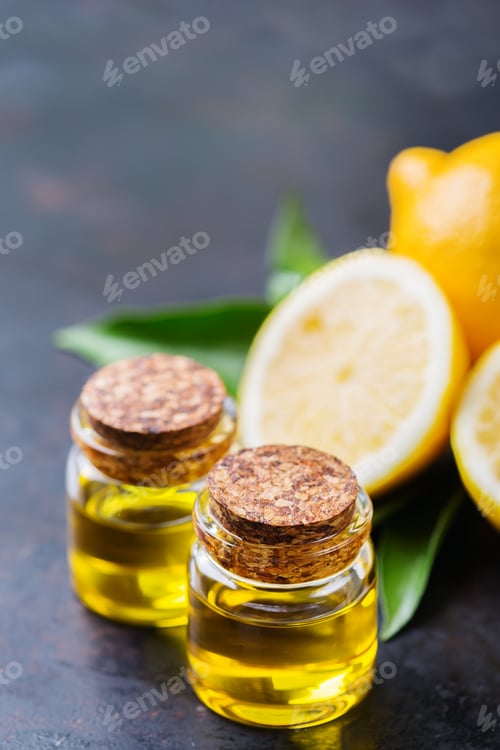 Preview: Organic essential lemon oil with green leaves and fruit