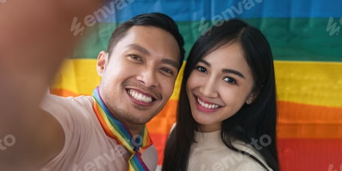 Preview: An attractive and cheerful Asian gay man enjoys talking while Selfie with his female friend a
