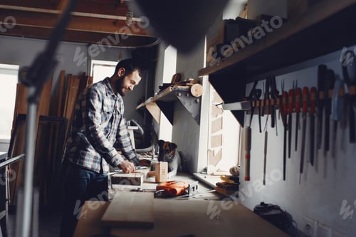 Preview: The carpenter works with a tree