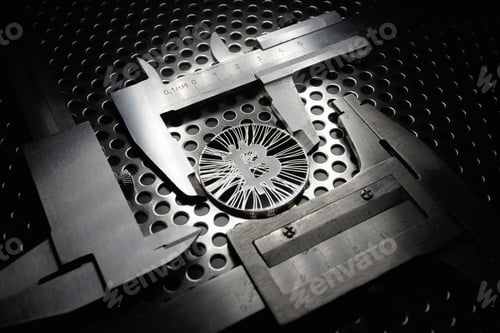 Preview: Bitcoin measured with caliper on metal background. Concept of international virtual cryptocurrency