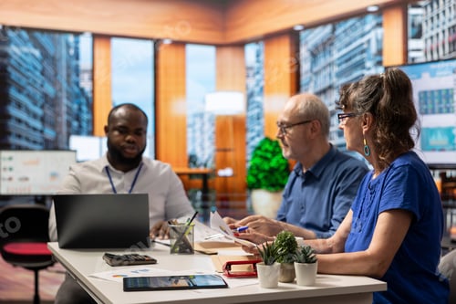 Preview: Senior people analyzing financial pension plans with an expert