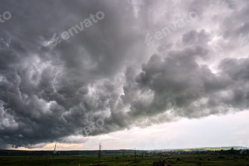 Preview: Landscape of dark ominous clouds like volcano eruption on stormy sky during heavy thunderstorm