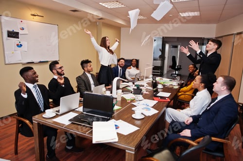Preview: Multiracial young creative people in modern office