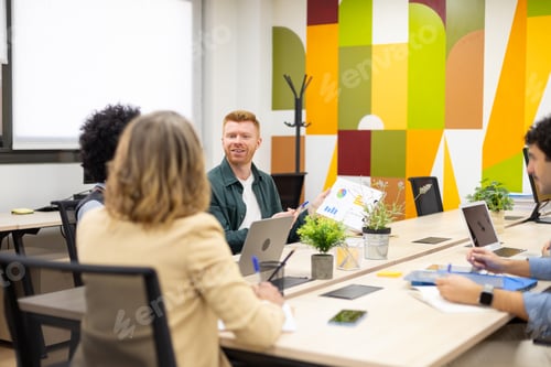 Preview: Business team collaborating during office meeting with charts