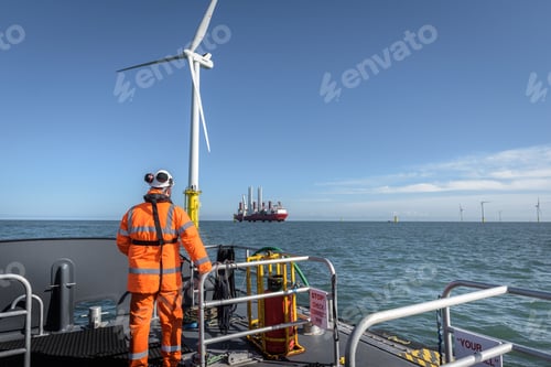 Preview: Crew member on deck of boat on offshore wind farm