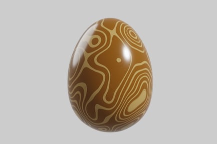 Preview: Egg-shaped object with wavy brown and tan lines