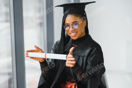 Preview: cheerful african american graduate student with diploma in her hand