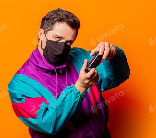 Preview: Style man in face mask and 80s tracksuit with game controller