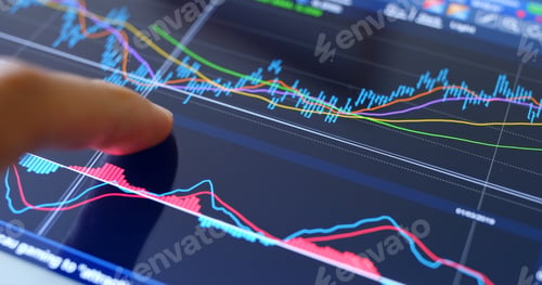 Preview: Finger touch on screen with stock market data