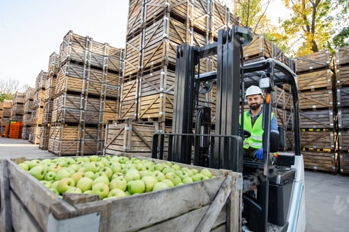 Preview: Loading apples with forklift, transport of goods to industrial production juice