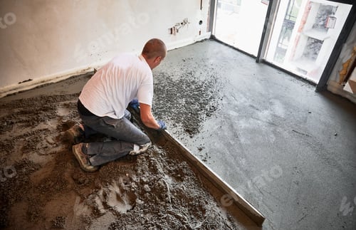 Preview: Man Smoothing Fresh Concrete in a Room