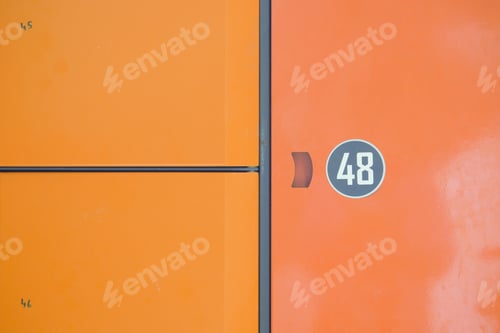 Preview: orange color storage box in public place. safe storage locker for shopping malls