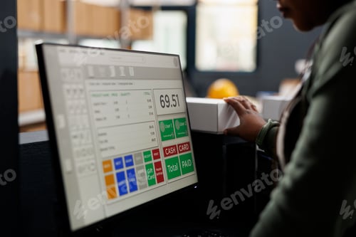 Preview: Manager looking at products delivery details on computer