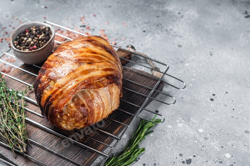 Preview: Baked meatloaf with bacon, meat loaf on a grill. Gray background. Top view. Copy space