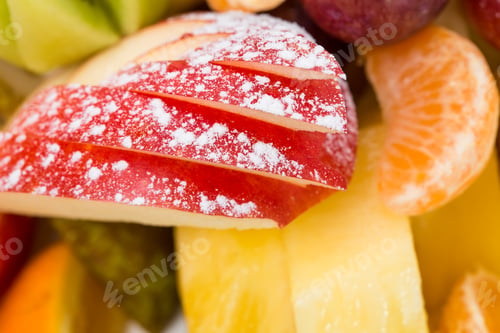 Preview: Sliced apple covered sugar powder.