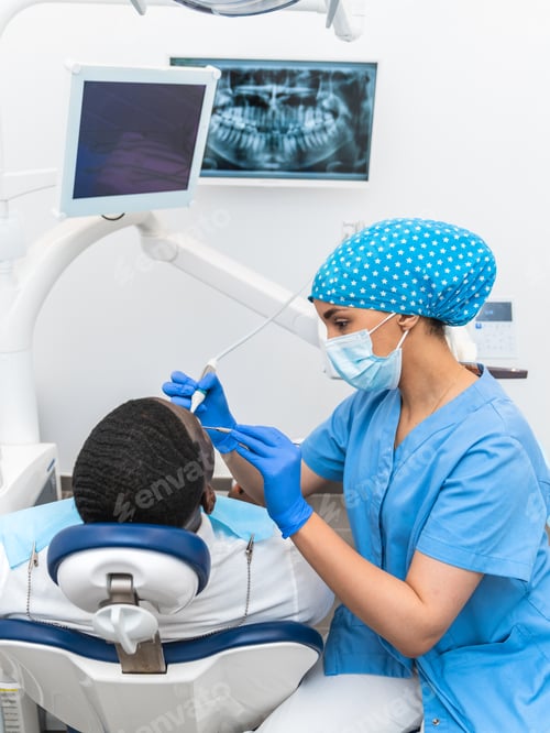 Preview: Dental hygienist conducting an oral examination using precision tools in a modern dental clinic.