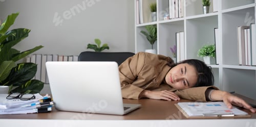 Preview: Asian businesswoman feeling tired and stressed over an unsuccessful business while working in a home