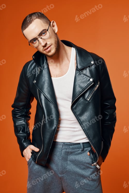 Preview: man in leather jacket posing fashion orange background model