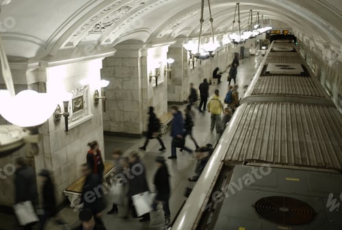 Preview: Blurred people on subway platform.