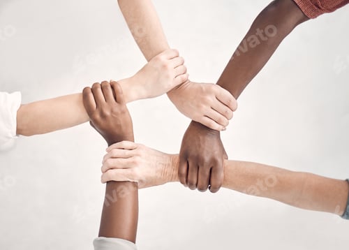 Preview: Businesspeople gripping and holding each others wrists in an office at work. Business professionals