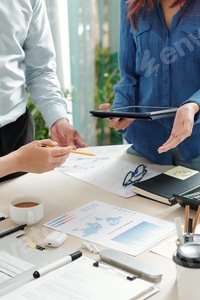 Preview: Business Team Collaborates on Charts and Data