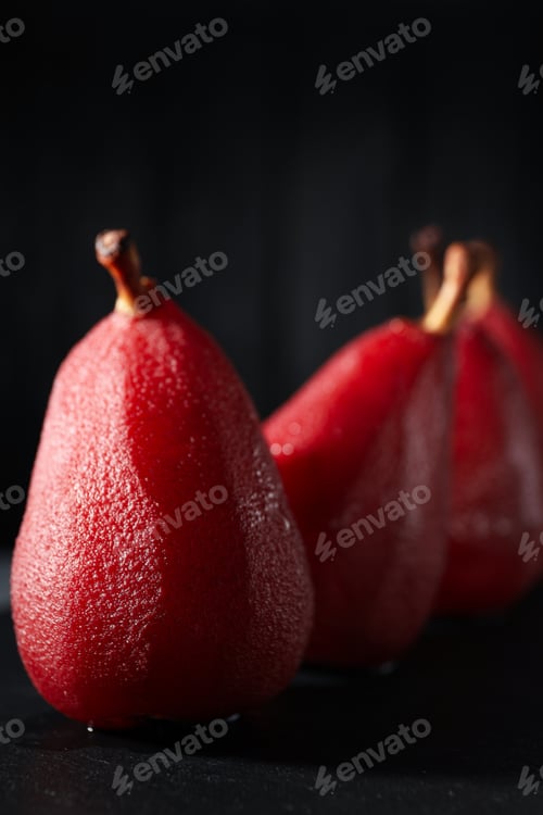 Preview: Tasty and delicious food concept - pear in wine