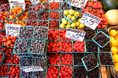 Preview: Assorted Berries at a farmers market in vibrant colors.