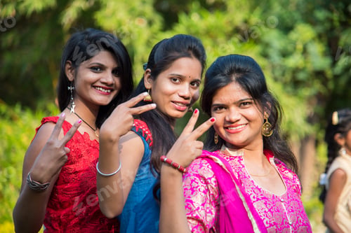 Preview: Happy Indian young girls smiling and having fun at outdoor.
