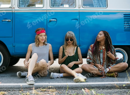 Preview: Group of Diverse Friends on Road Trip Sitting by the Car Togethe