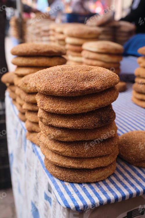 Preview: Stacks of traditional moroccan khobz bread for sale in marrakech