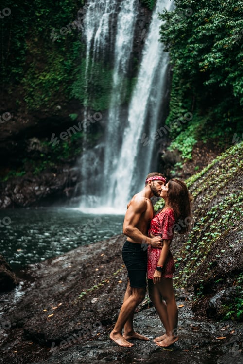 Preview: Couple in love at the waterfall. A couple in love travels the world. Guy and girl traveling