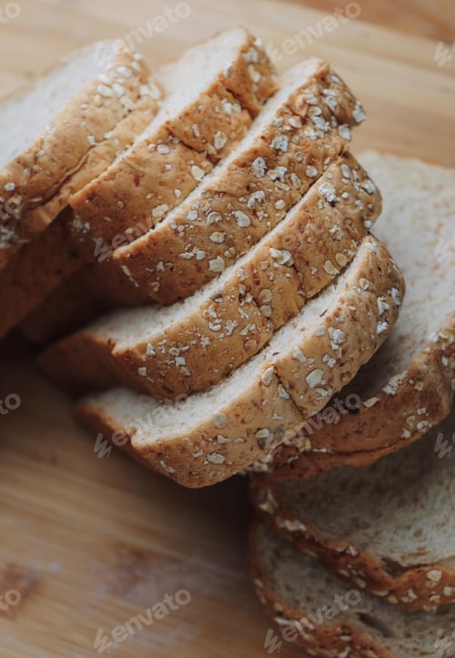 Preview: Sliced whole wheat bread on wooden table