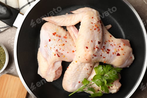 Preview: Composition with raw chicken and spices on gray background. Cooking chicken