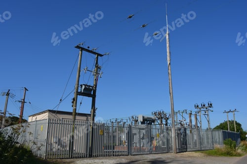Preview: Electricity substation with high voltage warning signs on perimeter fence