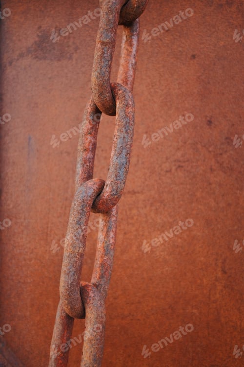 Preview: detail of a rusty old chain link on a metal background