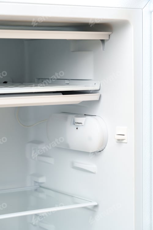 Preview: White Refrigerator Open Against Brick Wall