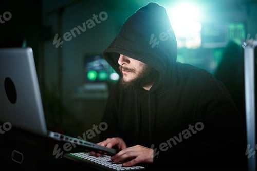 Preview: Hacker man making a computer attack starting to typing on laptop keyboard and breaking password.