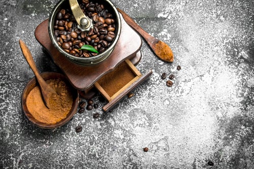 Preview: old hand-grinder with coffee beans.