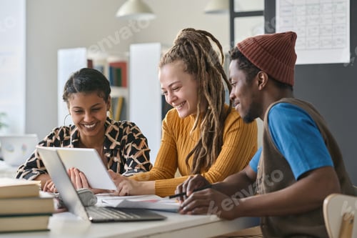 Preview: Multiethnic students using tablet pc in study