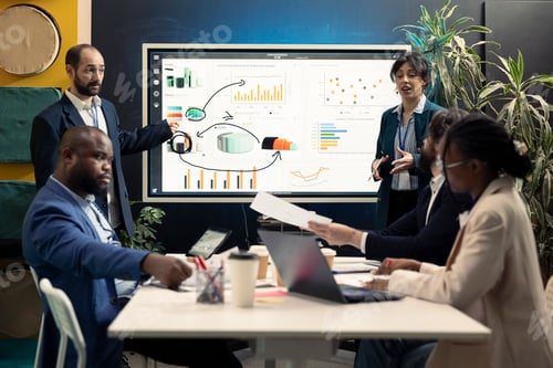 Preview: Team of partners working on resource allocation initiatives during a meeting