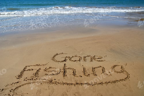 Preview: Gone Fishing, message written in the sand on the beach Magnetic Island, Queensland, Australia