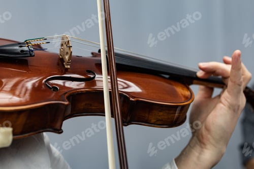 Preview: Close-up shot of a person playing on a violin