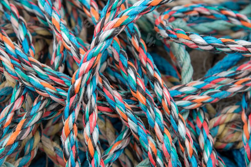 Preview: Pile of fishing rope and nylon netting. Close up view
