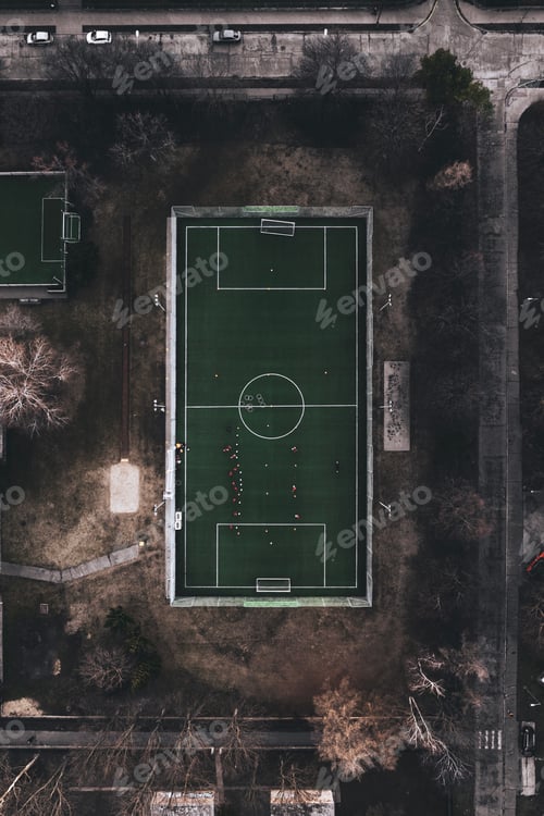 Preview: Top view of a small training football field in the city. Soccer pitch with artificial turf in an