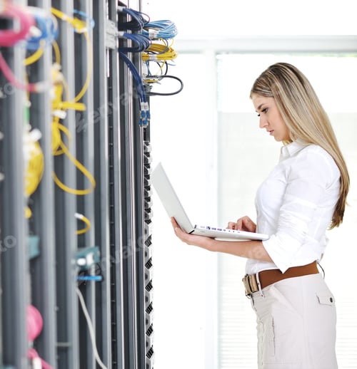 Preview: Young Female Engineer Businesswoman With Modern Laptop In Network Server Room
