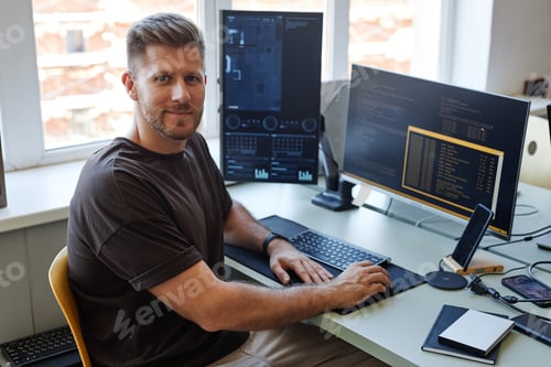 Preview: Computer Programmer Smiling at Camera